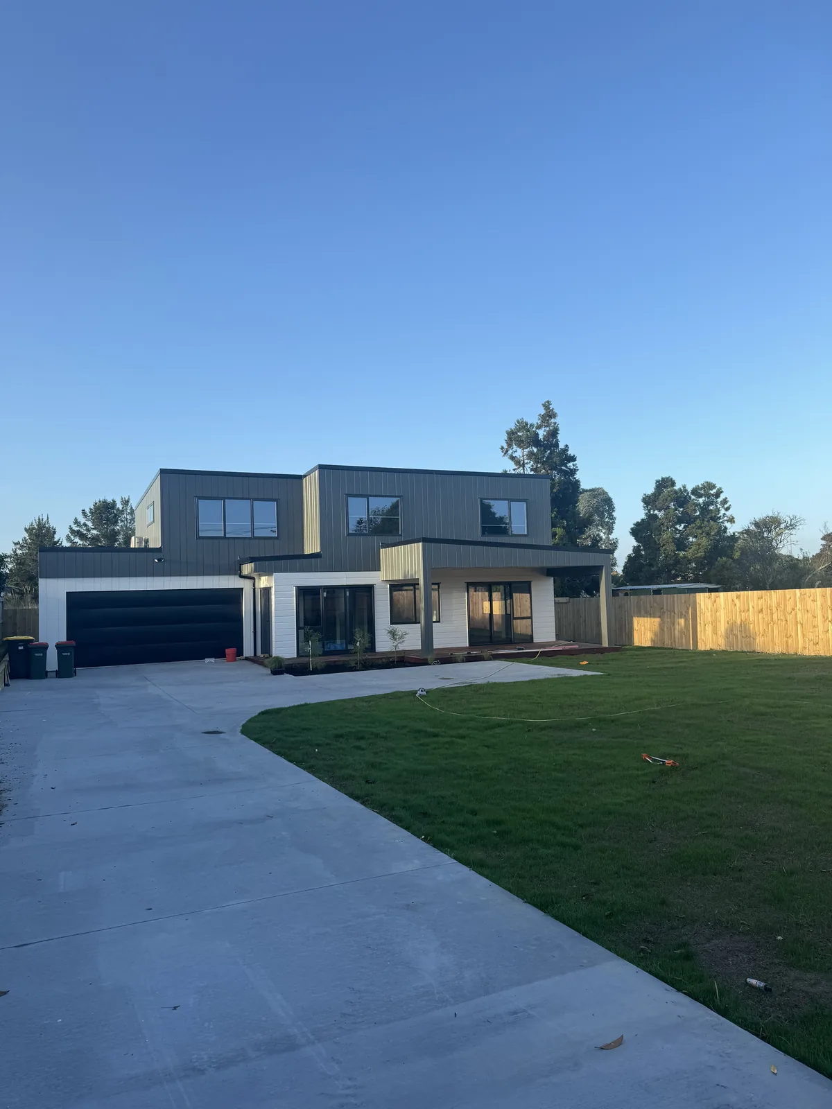Finished two-storey new build with double garage, driveway and lawn